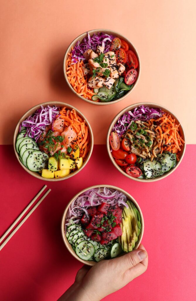 person taking bowl with hawaiian dish